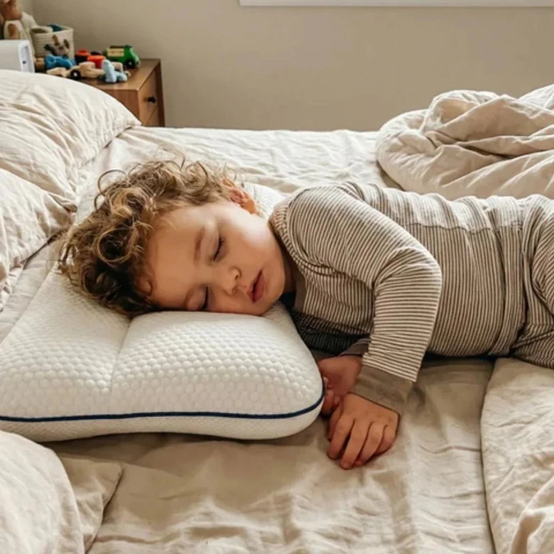 Child sleeping peacefully on the pillow